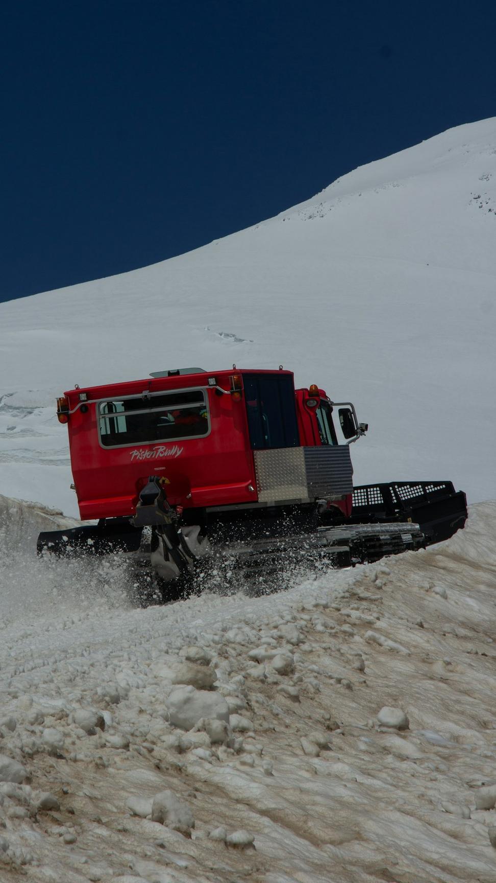 Heavy-duty trucks on rugged mountain terrain